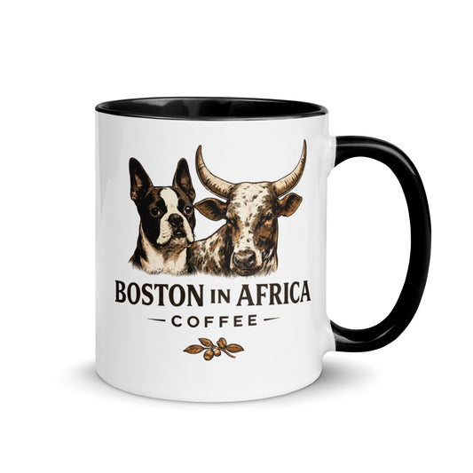 White 11 oz ceramic coffee mug with a black interior and Boston in Africa Coffee branding.